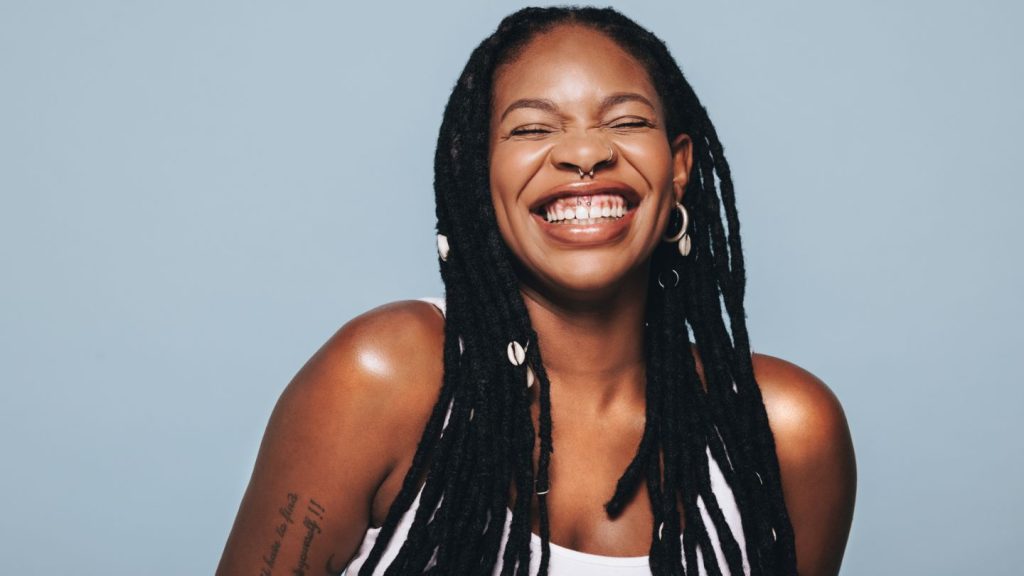 Smiling Woman Showing Healthy Teeth